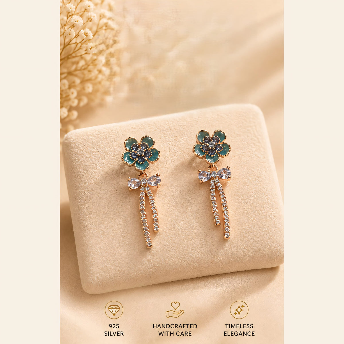 Teal flower earrings with sparkling bows and tassels