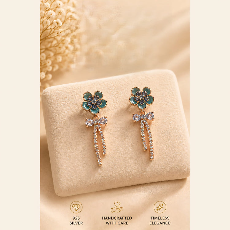 Teal flower earrings with sparkling bows and tassels