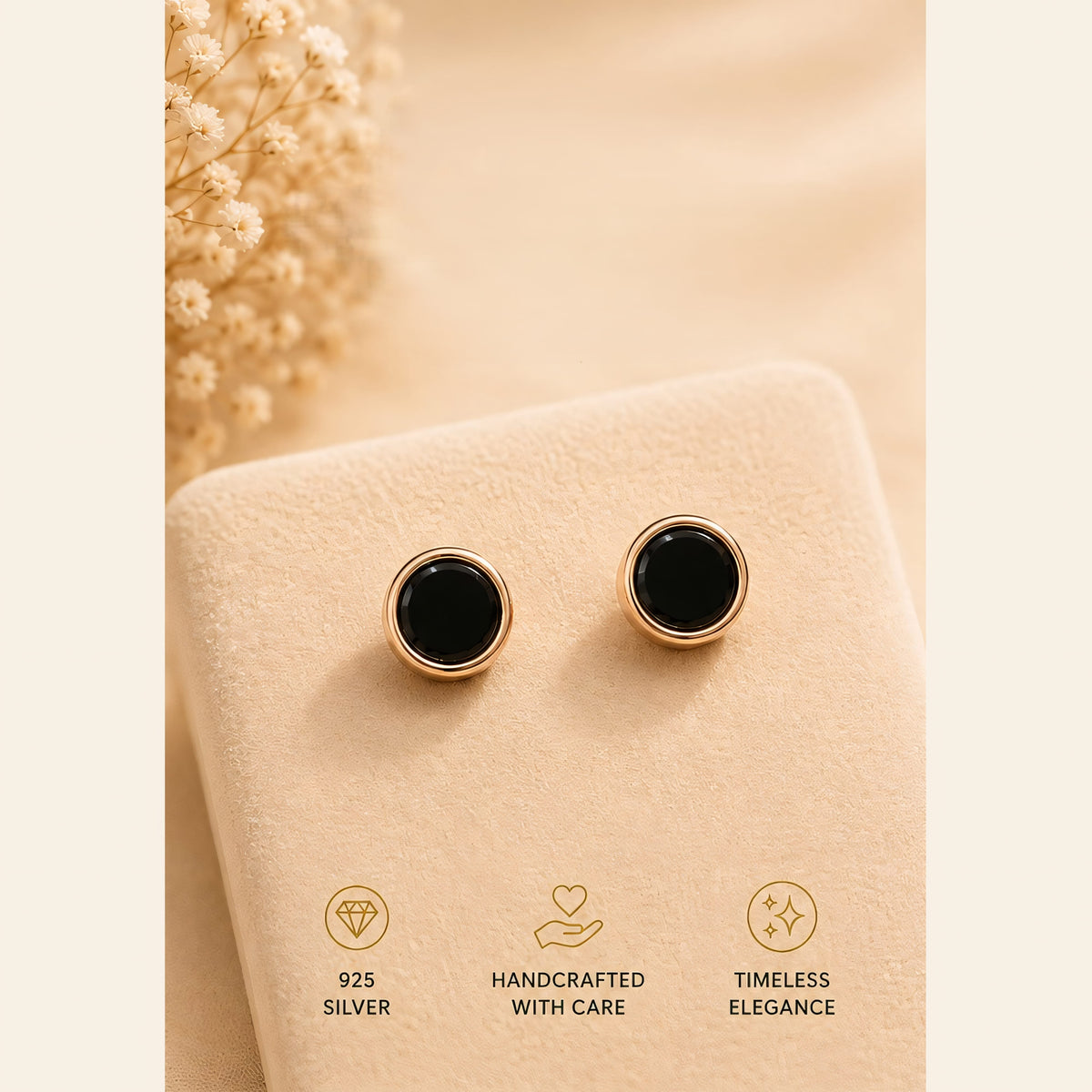 Black round stud earrings with rose gold tone frames
